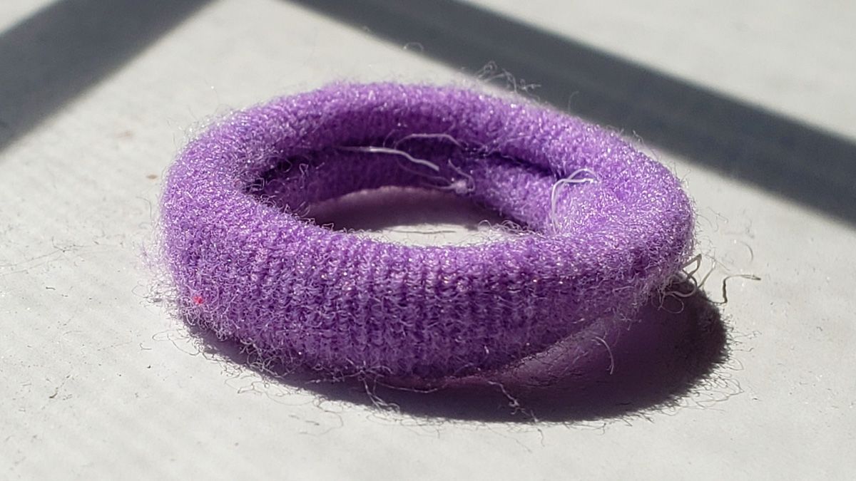 A stock photo of a purple hair tie. (Credit: Snopes.com) (Snopes.com)